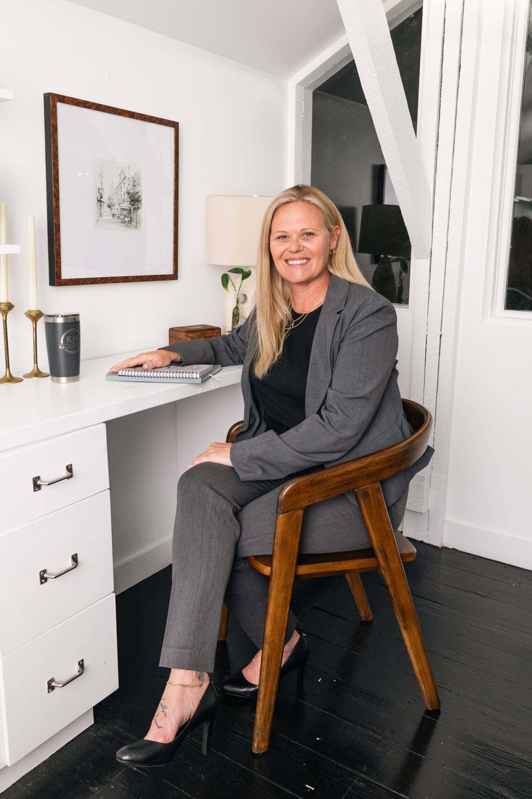 Kelly McCue seated in her office, personal injury attorney serving St. Petersburg and Tampa Bay